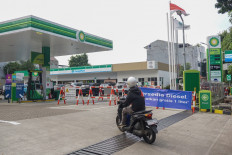 Finding fuel: A motorist enters a BP gas station on Sept. 17 in Jakarta.