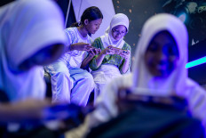 Junior high school students play Roblox during a city-run extracurricular program at Solo Technopark in Surakarta, Central Java, on Sept. 17, 2025. The program is designed to boost students’ creativity and deliver positive digital education through game-based learning, according to city officials.