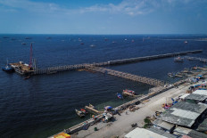 A breakwater construction project is seen on Sept. 4 off the coast of Cilincing, Jakarta. Fishermen have complained that the structure, part of a planned expansion of the nearby Marunda Port, blocks their traditional fishing routes, forcing them to take longer and more costly detours.