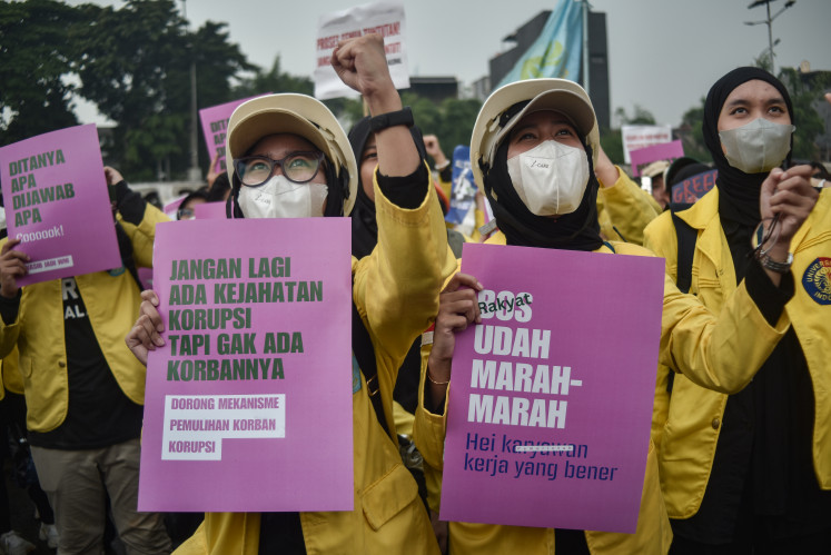 Time to deliver: University students hold posters of demands during a protest on Sept. 9, 2025, in front of the House of Representatives complex in Senayan, Jakarta. The demonstration, dubbed "Rakyat Tagih Janji" (The people call in promises), was held to push for the fulfillment of public demands known as the “17+8”.