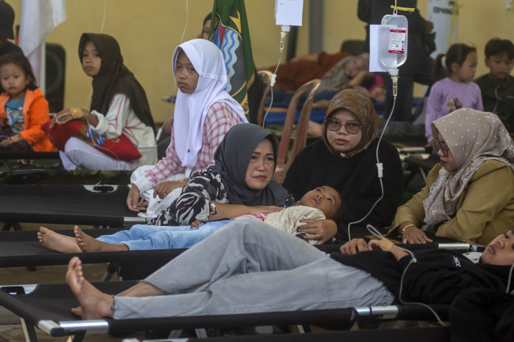 Meals go wrong: Students affected by food poisoning after consuming the free nutritious meal undergo medical treatment on Sept. 23 at Cipongkor District Office, West Bandung Regency, West Java. According to official data, a total of 352 students and parents experienced food poisoning, suspected to have been caused by the free meals program on Sept. 22. 