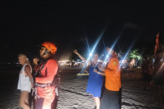 Personnel from the Denpasar Search and Rescue Office coordinating efforts to find British man Edward Nada Kantounas who went missing while swimming at Legian beach in Badung regency, Bali, on Wednesday. Lifeguards at the beach had warned the man and two of his friends to get out of the red-flagged area of the beach.