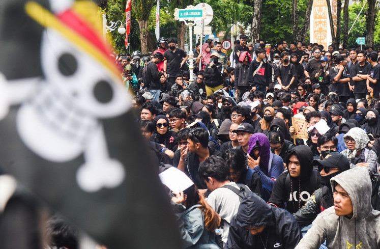 Protesters attend a demonstration on Sept. 1 in front of the Balikpapan Representative Council in Balikpapan, East Kalimantan. 