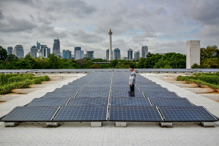 A maintenance staff member inspects solar panels installed on the roof of the Istiqlal Mosque building on Dec. 5, 2024, in Jakarta.