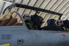 Sky warriors: Indonesian Air Force fighter jet pilots prepare to fly a Rafale aircraft on Sept. 24 at St. Dizier-Robinson air base in France.