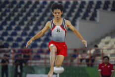 This picture taken on August 30, 2024, shows Indonesian gymnast Naufal Takdir Al Bari representing East Java at the 21st National Sports Week in Deli Serdang, North Sumatra. Olympic hopeful Naufal, 19, died in Russia nearly two weeks after suffering an accident during training, the local federation said on Sept. 26, 2025. 