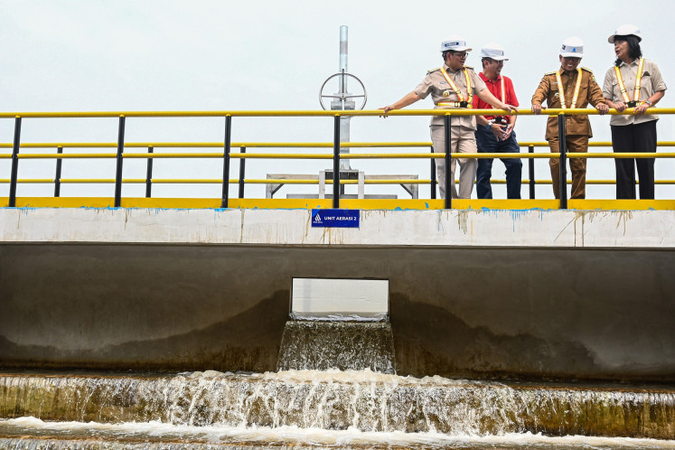 Jakarta Governor Pramono Anung (left) inspects the Pesanggrahan Water Treatment Plant (IPA) in Lebak Bulus, South Jakarta, with Banten Governor Andra Soni (second right), Deputy Public Works Ministry Diana Kusumastuti (right) and Jakarta-owned water company PT PAM Jaya president director Arief Nasrudin on Sept. 9, 2025.