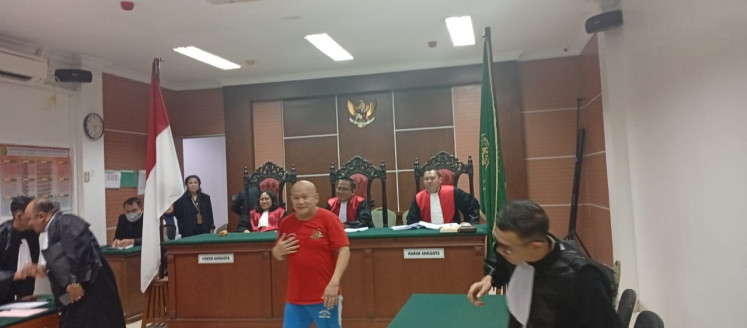 Batam activist Yusril Koto appears before the Batam District Court on Tuesday. He was sentenced to six months in prison and fined Rp 15 million (US$901.87) for defaming a Satpol PP officer in TikTok videos.