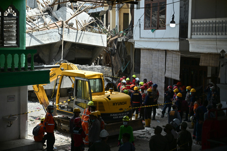 Rescuers search for survivors at Al Khoziny Islamic boarding school in Sidoarjo, East Java on Oct.1, 2025, after the multi-storey school building collapsed two days earlier. Around 91 people are believed to be still trapped under the ruins of a collapsed school on Indonesia's main island of Java, National Disaster and Mitigation Agency spokesperson Abdul Muhari said.