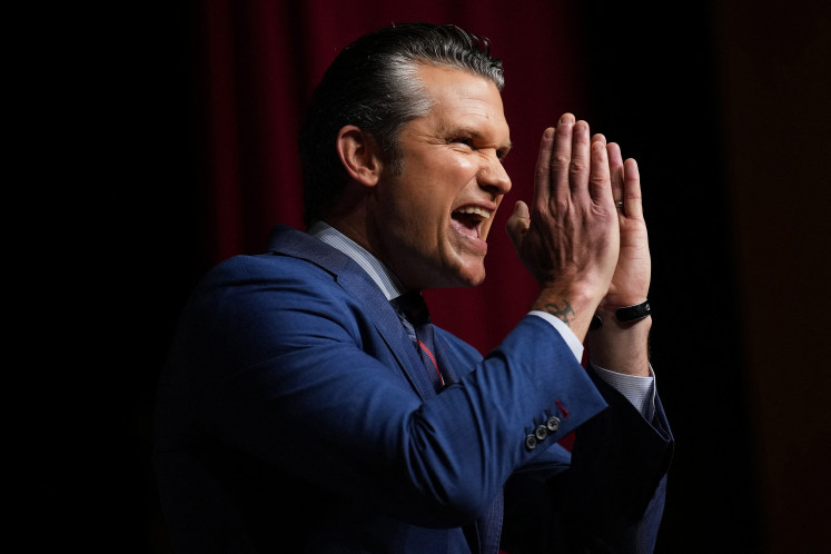 Strategic reorganization: United States Secretary of War Pete Hegseth gestures on Tuesday while addressing senior military leaders at Marine Corps Base Quantico in Virginia.