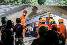The National Search and Rescue Agency (Basarnas) search for victims amidst the rubble of a collapsed building after a hall collapsed while students were praying at the Al-Khoziny Islamic boarding school in Sidoarjo, East Java, Sept. 29, 2025. 