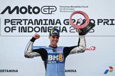 BK8 Gresini Racing MotoGP team's Spanish MotoGP rider Fermin Aldeguer celebrates on the podium after winning the MotoGP Indonesian Grand Prix at the Mandalika International Circuit in Mandalika, West Nusa Tenggara on October 5, 2025. 