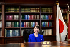 Sanae Takaichi, the newly elected leader of Japan's ruling party, the Liberal Democratic Party (LDP), poses in the party leader's office after the LDP leadership election in Tokyo on Oct. 4, 2025.