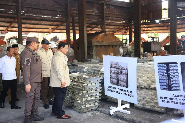 President Prabowo Subianto (second left, front) makes an inspection visit to the Bangka Belitung Islands on Oct. 6, 2025, prior to the handover of seized tin ingots worth up to Rp 7 trillion (US$422 million) by the Office of the Assistant Attorney General for Extraordinary Crimes to state-owned miner PT Timah and state asset fund Danantara.