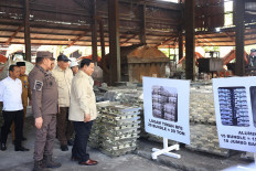 President Prabowo Subianto (second left, front) makes an inspection visit to the Bangka Belitung Islands on Oct. 6, 2025, prior to the handover of seized tin ingots worth up to Rp 7 trillion (US$422 million) by the Office of the Assistant Attorney General for Extraordinary Crimes to state-owned miner PT Timah and state asset fund Danantara.