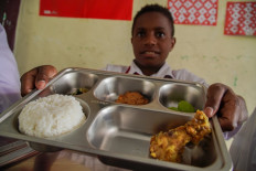 A student shows a school meal he received as part of the free nutritious meal program on Sept. 15 at the Nurul Islam Klakah integrated Islamic elementary school (SDIT) in Lumajang, East Java. 