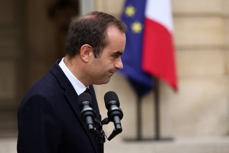 Outgoing French Prime Minister Sebastien Lecornu, who submitted his government's resignation to the French President this morning, reacts after delivering a statement at the Hotel Matignon in Paris, on October 6, 2025. 