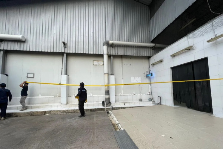 Environment Ministry officers seal off a factory belonging to PT PMT, which is suspected to be the source of Cesium-137 radioactive contamination in the Cikande Industrial Estate, Banten, on Sept. 11, 2025.