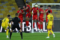 Singapore's Safuwan Baharudin (4 right) heads the ball against Malaysian players during the international friendly football match between Malaysia and Singapore at the National Stadium Bukit Jalil in Kuala Lumpur on September 4, 2025. 
