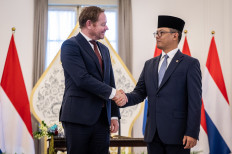 Foreign Minister Sugiono (right) shakes hands with Dutch Foreign Minister David van Weel (left) on Thursday before their bilateral meeting at the Foreign Ministry office in Jakarta. During the meeting, which took place in van Weel's first visit to Indonesia since assuming office in early September, both ministers discussed various topics, including the repatriation of artifacts unearthed in Indonesia during the Dutch colonial era and cooperation to push for a sustainable palm oil supply chain.