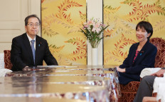 Japan's Liberal Democratic Party (LDP) President Sanae Takaichi (right) and Komeito Party leader Tetsuo Saito attend a meeting of party leaders at the Diet in Tokyo on October 10, 2025.