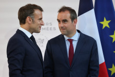 France's President Emmanuel Macron (left) speaks with France's then-minister of armed forces Sebastien Lecornu after delivering a speech to army leaders at l’Hôtel de Brienne in Paris, France on July 13, 2025, on the eve of the annual Bastille Day Parade in the French capital. Macron reappointed Sébastien Lecornu as prime minister on Oct. 10, 2025 evening, four days after his resignation, the presidency announced in a statement.