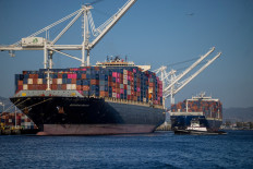 A cargo ship full of shipping containers is seen at the port of Oakland, California, the United States, on Aug. 4, 2025.