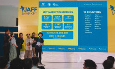 Cinematic vision: Linda Gozali (sixth left, at mic), director of the Jogja-NETPAC Asian Film Festival (JAFF) Market, speaks during the event’s inaugural 2024 edition, which ran from Dec. 3 to 5 at the Jogja Expo Center in Yogyakarta. (Courtesy of JAFF Market)