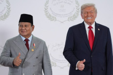 US President Donald Trump greets President Prabowo Subianto during a summit on Gaza in Sharm el-Sheikh on October 13, 2025. Trump landed in Egypt on October 13 for a summit on Gaza, following a lightning visit to Israel after a ceasefire he brokered entered into force. 
