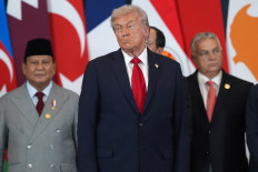 US President Donald Trump listens as Egypt's President Abdel Fattah al-Sisi (not pictured) delivers a statement during a summit on Gaza in Sharm el-Sheikh on October 13, 2025. 