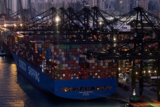 A general view shows the container terminals and a Cosco Shipping vessel at Kwai Chung district in Hong Kong, China, on Nov. 28, 2024.