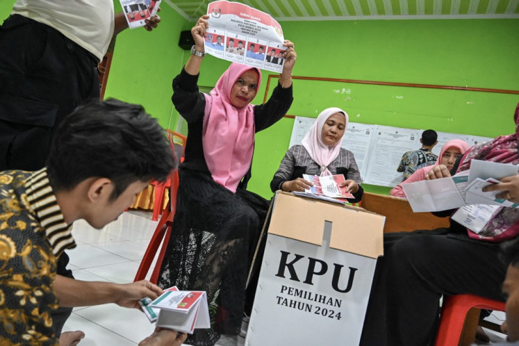 Poll workers count ballots at a polling station in Banda Aceh, Aceh, on Nov. 27, 2024, after voters cast their votes to pick local leaders in the country's biggest simultaneous regional election. More than 200 million people were eligible to vote to choose dozens of governors and mayors and 415 regents.