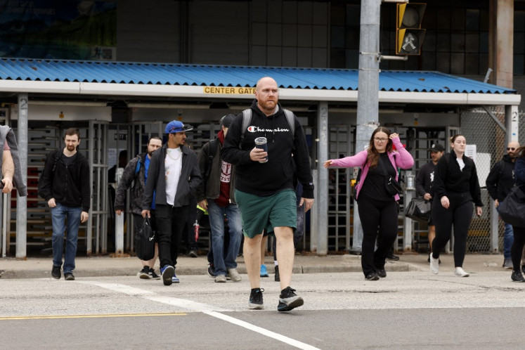Worker leave during a shift change at Stellantis Windsor Assembly Plant in Windsor, Ontario, on April 3, 2025.