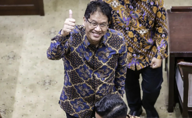 Thumb up: Finance Minister Purbaya Yudhi Sadewa reacts to journalists after his first hearing with the House of Representatives’ finance commission on Sept. 11 in Jakarta. 