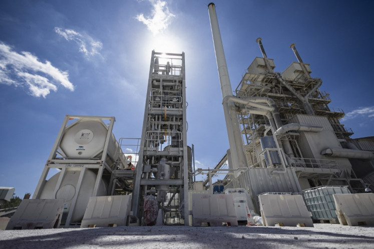 This photograph shows an industrial prototype in a lime production site capturing CO2 at an Eiffage factory serving as a pilot site for the start-up Revcoo in Haut-Lieu, near Avesnes-sur-Helpe, northern France on June 24, 2025. 
