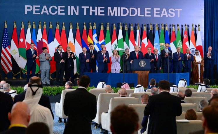 President Prabowo Subianto (on stage, second left) applauds as United States President Donald Trump (on stage, eighth right) address the summit on Gaza peace process in Sharm el-Sheikh, Egypt on Oct. 13, 2025.