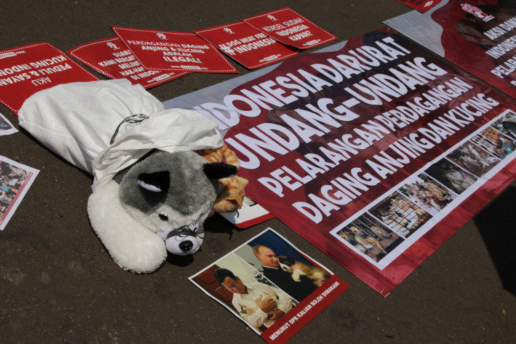 Activists and animal lovers protest on Nov. 21, 2024, in front of the Senayan Legislative Complex in Central Jakarta against the rejection of a bill banning dog meat consumption.