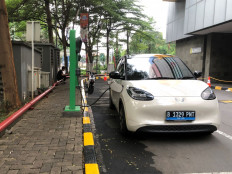 Battery power: An electric car recharges Sept. 17, 2025 at a charging station inside an apartment complex in Jakarta.