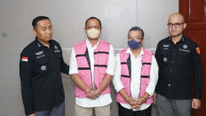 Prosecutors from the North Sumatra Prosecutor's Office detain Askani, head of the National Land Agency's (BPN) North Sumatra regional office in 2022-2024, and Rahim Lubis, head of the BPN Deli Serdang office in 2023-2025, on Oct. 14, 2025, for their alleged involvement in a corruption case in Medan. Both suspects allegedly misused their authority by approving the conversion of  right-to-use (HGU) certificates into right-to-build (HGB) certificates for PT Nusa Dua Propertindo (NDP), a subsidiary of state-owned plantation PT Perkebunan Nusantara I. 