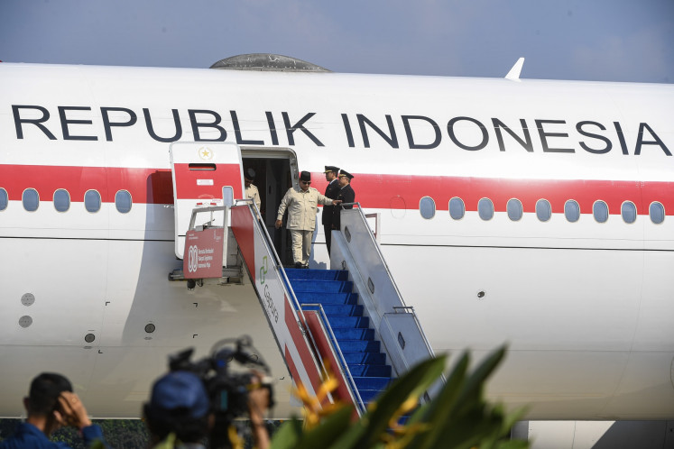 Globe-trotting leader: President Prabowo Subianto disembarks presidential plane Indonesia One at the Halim Perdanakusuma Air Force Base in East Jakarta on Oct. 14, 2025, a day after attending the Gaza peace summit and Israel-Hamas ceasefire declaration in Sharm el-Sheikh, Egypt.