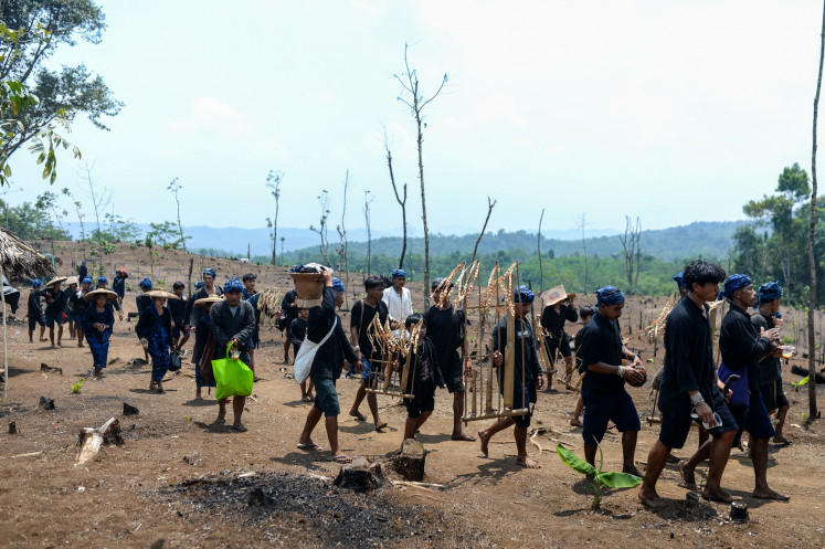 Badui tribe members play traditional Sundanese angklung during the annual Ngaseuk ceremony in Lebak, Banten, on Oct. 5, 2025 to celebrate the planting of rice on dry land to fulfill their daily needs. 