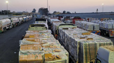 Trucks carrying humanitarian aid and fuel line up at the crossing into the Gaza Strip at the Rafah border on the Egypt side on Oct. 17, 2025 amid a ceasefire between Israel and Hamas in Gaza.