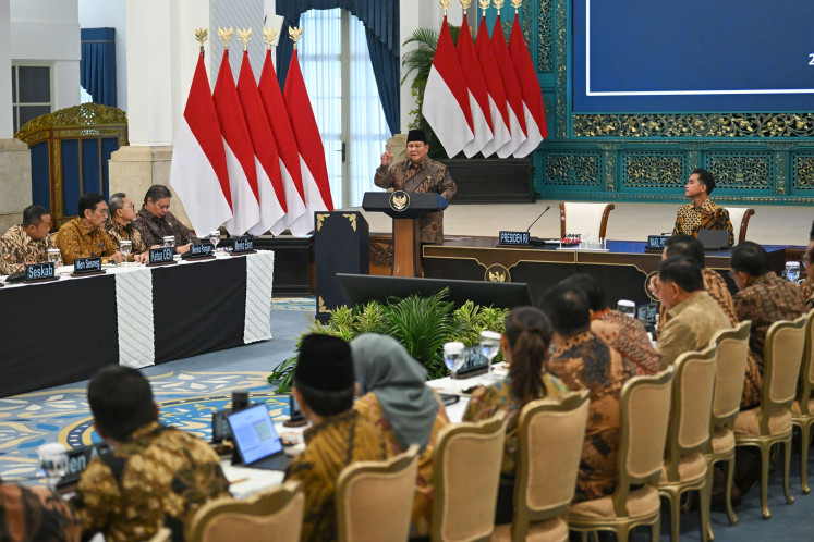 President Prabowo Subianto (top, center) delivers his speech as witnssed by Vice President Gibran Rakabuming Raka (top, right) during the plenary cabinet meeting at the State Palace in Jakarta on Oct. 20, 2025.