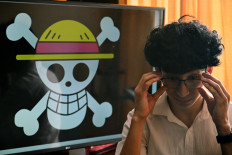 Peruvian student Wildar Lozano, 20, of the Gen Z movement, straightens his glasses during an interview with AFP in Lima on October 18, 2025. 