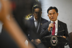 Coordinating Law, Human Rights, Immigration and Correctional Service Minister Yusril Ihza Mahendera talks to journalists during a press briefing in Jakarta on Oct. 21, 2025 on the signing of an agreement with the United Kingdom on the repatriation of two British nationals convicted in drug crimes in Indonesia.