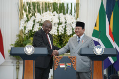 South African President Cyril Ramaphosa (left) shakes hands with President Prabowo Subianto on Wednesday in Jakarta, after the two leaders issued a joint statement pledging to advocate for Global South interests at both the bilateral and multilateral levels.
