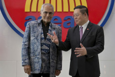 Timor Leste's President Jose Ramos-Horta (left) and Secretary General of the Association of Southeast Asian Nations (ASEAN) Kao Kim Hourn chat at the ASEAN Secretariat in Jakarta on August 1, 2025. 