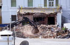 An excavator works to clear rubble after the East Wing of the White House was demolished on October 23, 2025 in Washington, DC. 
