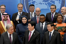 (Front, from left to right) United Nations secretary-general António Guterres, Vietnam's President Luong Cuong and Laos' General Secretary and President Thongloun Sisoulith pose with other leaders and delegates at the signing ceremony of the UN Convention on Cybercrime in Hanoi, Vietnam on Oct. 25, 2025. Countries signed their first UN treaty targeting cybercrime in Hanoi on Oct. 25, despite opposition from an unlikely band of tech companies and rights groups warning of expanded state surveillance.