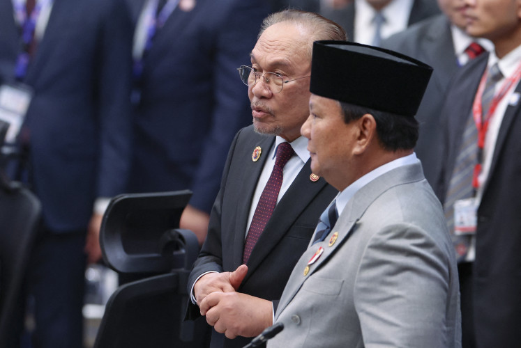 Malaysian Prime Minister Anwar Ibrahim (left) stands alongside President Prabowo Subianto at the 28th ASEAN-Japan Summit on Oct. 26, 2025, during the 47th ASEAN Summit in Kuala Lumpur.